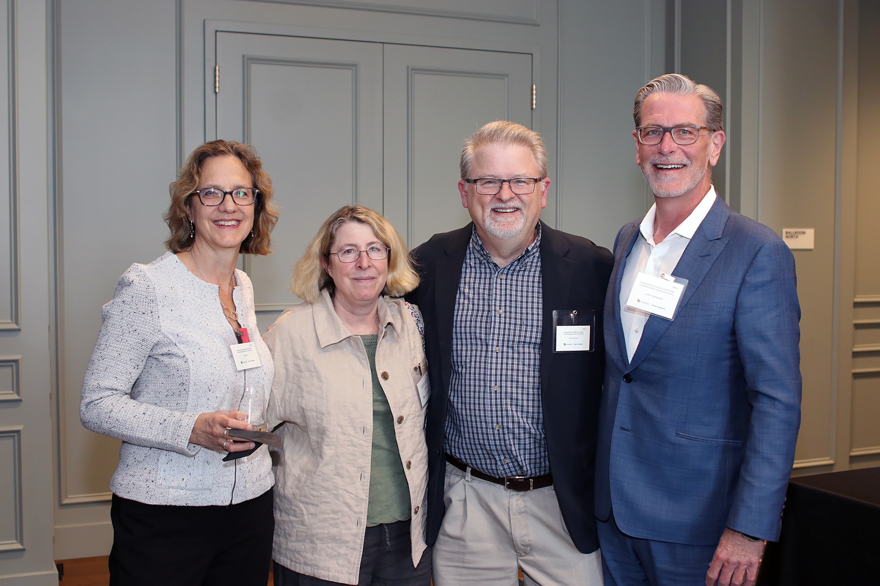 4peoplesmilingatcamera