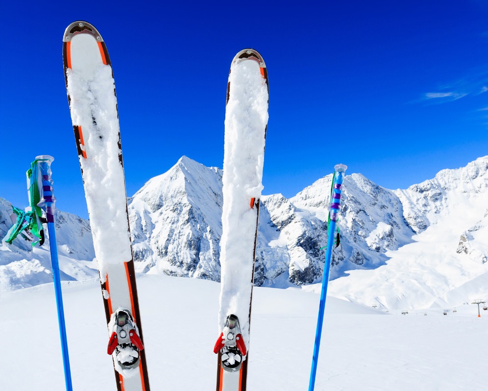 Skisandpolesstandinguprightinsnowymountainlandscape