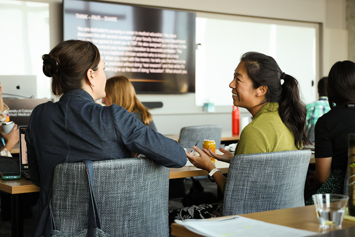 Teaching Scholars talking during session