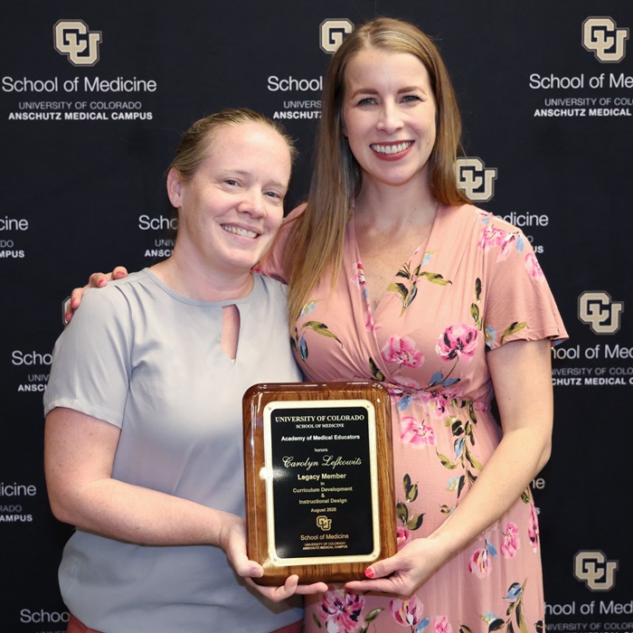 AMEmembersposingwiththeiraward