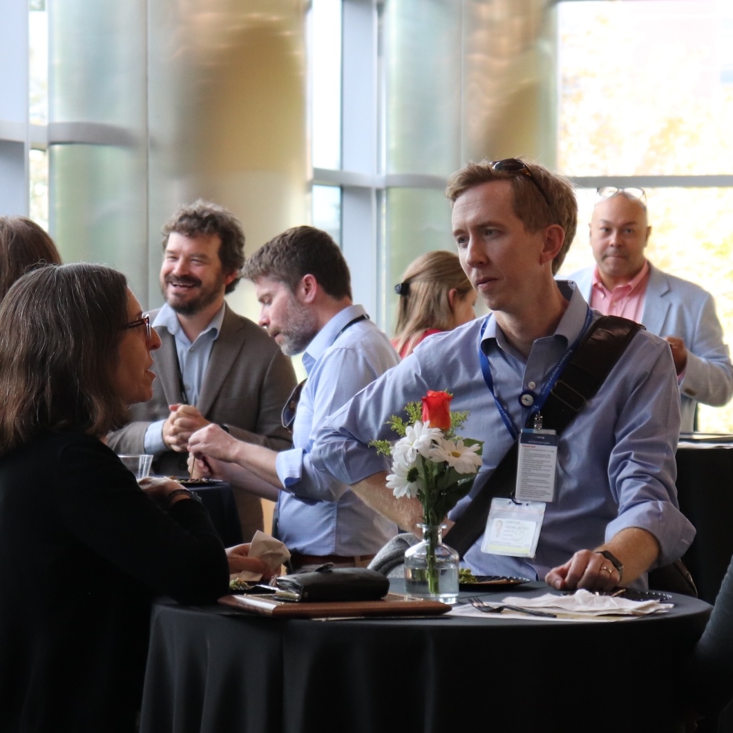 AME members talking during the reception