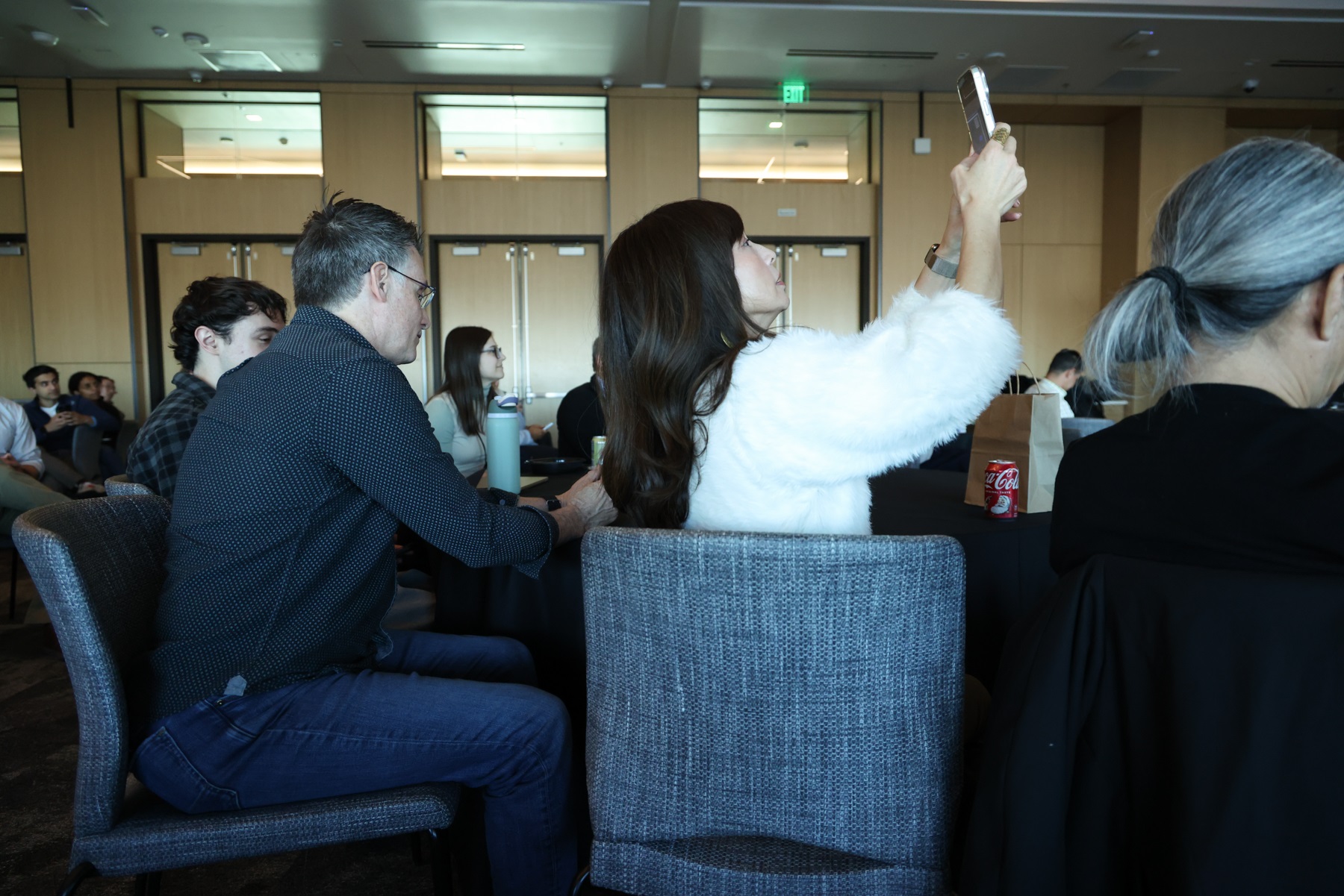 AudiencememberraisingphonetoscanQRcodetovote