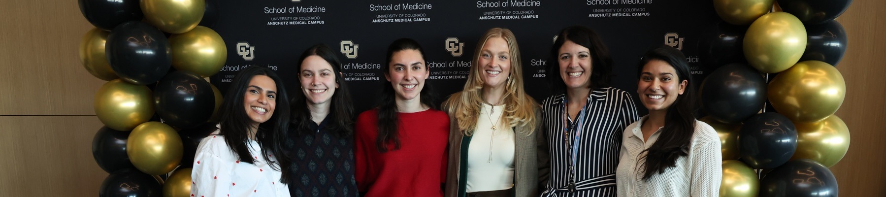 Presentersposinginfrontofphotobooth