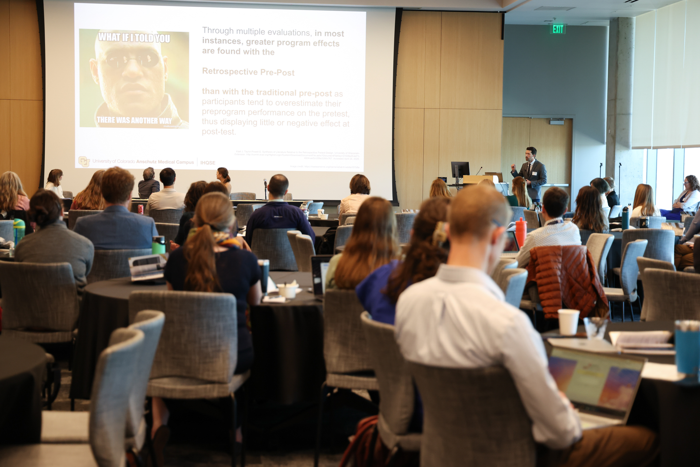 Personpresentinginfrontofaudience