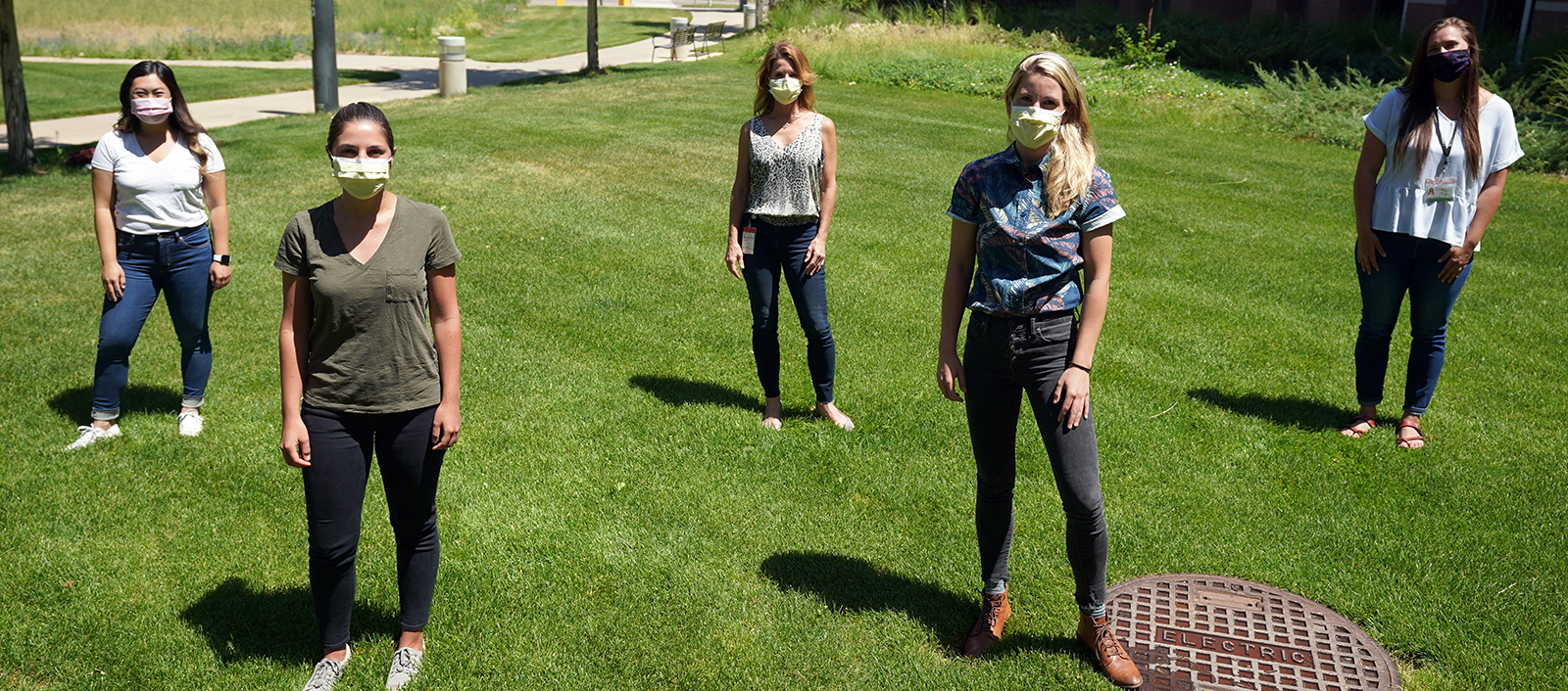 medicalstudentswearingmasksandstandingongrasssixfeetapart