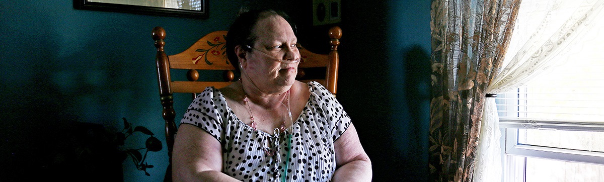 ConnieWalterssittinginrockingchairlookingoutwindow