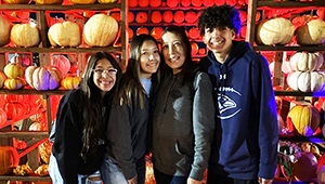 Karla and her kids with pumpkins