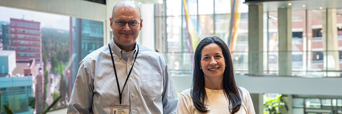 PayneandZuscikstandinginfrontofmanywindows