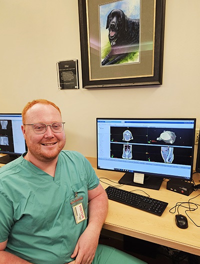 TristanSeawaltathisdeskwithdogportrait