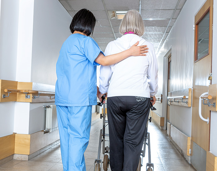 patientgettinghelpwalking