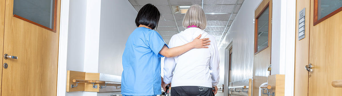 womanwithhelperinhallway