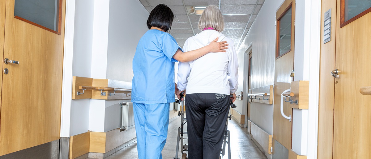 womanwithhelperinhallway