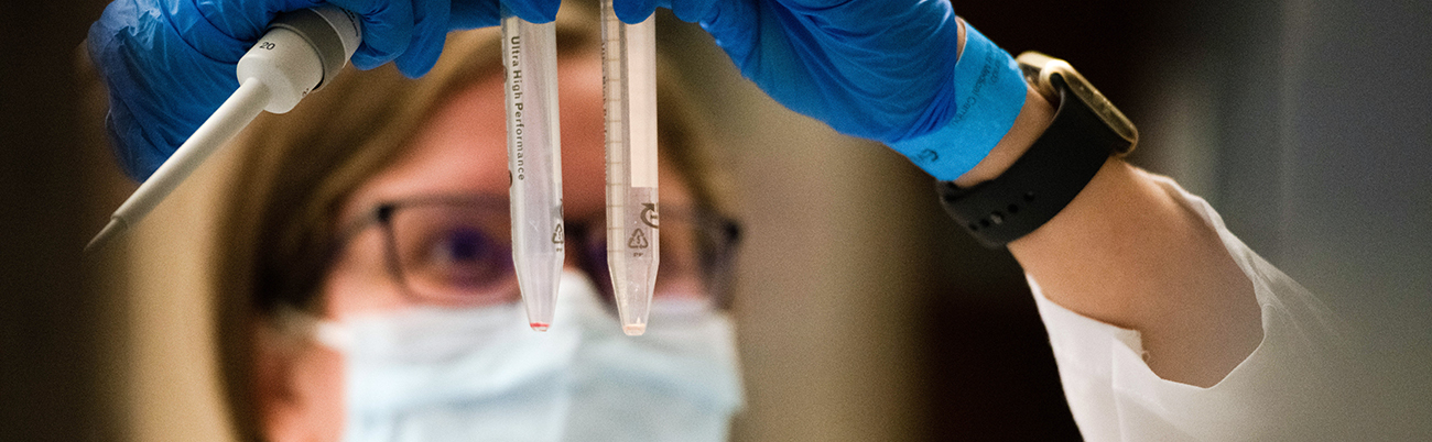 researcherlookingupattwovials