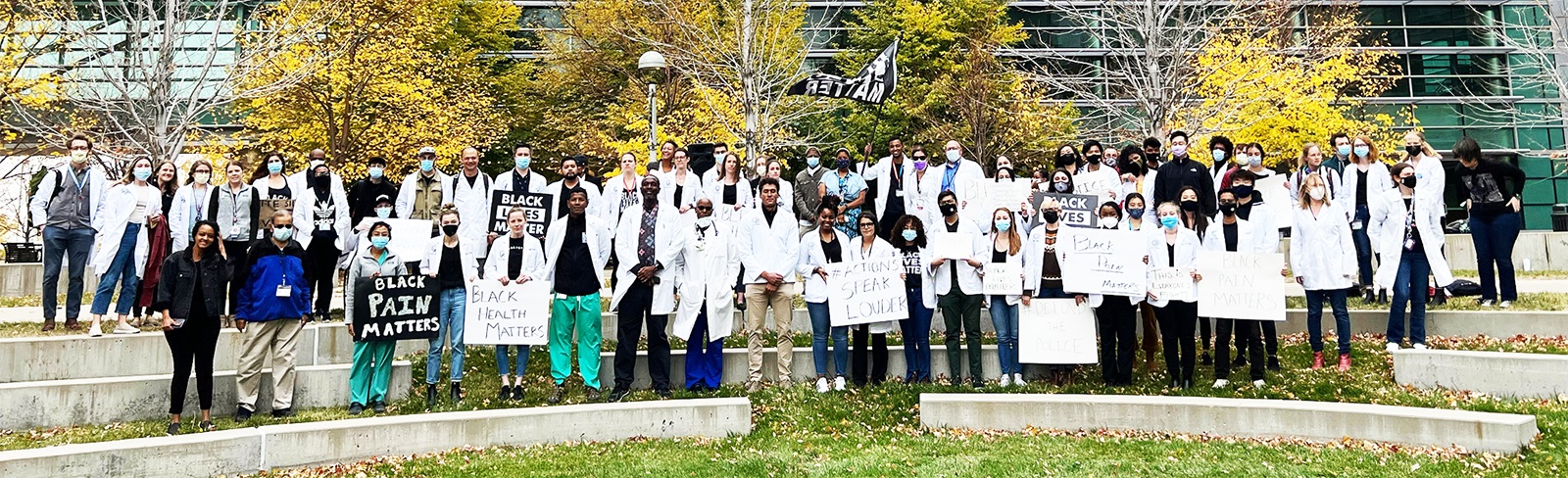 WhiteCoatsforBlackLivesgatheringoncampus