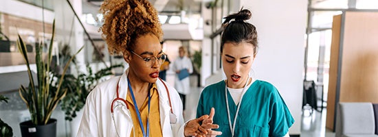 twohealthcareworkersinhallway