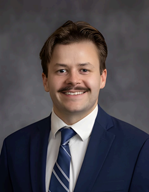 headshot of travis wigstrom