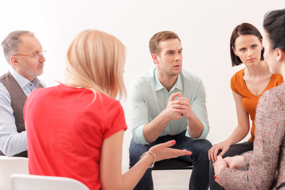 A group of people participating in therapy
