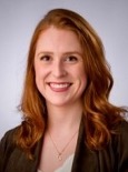 Headshot of a woman in a black blazer