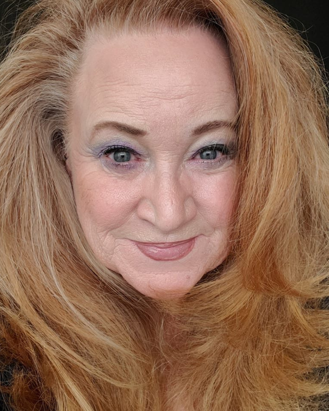 Blonde woman close up to the camera