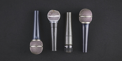 Four microphones in a row alternating up done placements