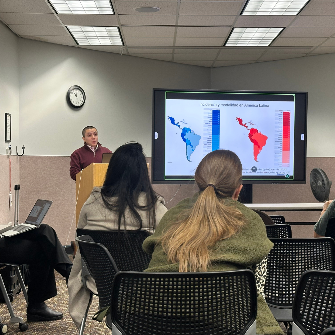 Man presents to a seated audience