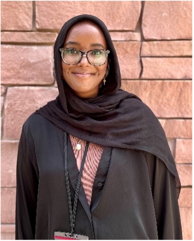 woman in black hijab smiling at camera