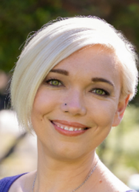 blond woman in a blue sweater