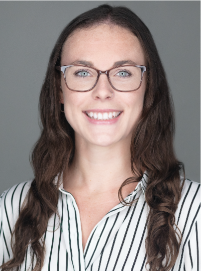 Brunette woman in a striped shirt and glasses