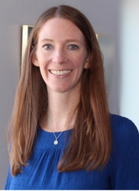 Woman in a blue shirt and sweater