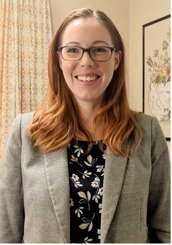 White woman with medium length brown hair