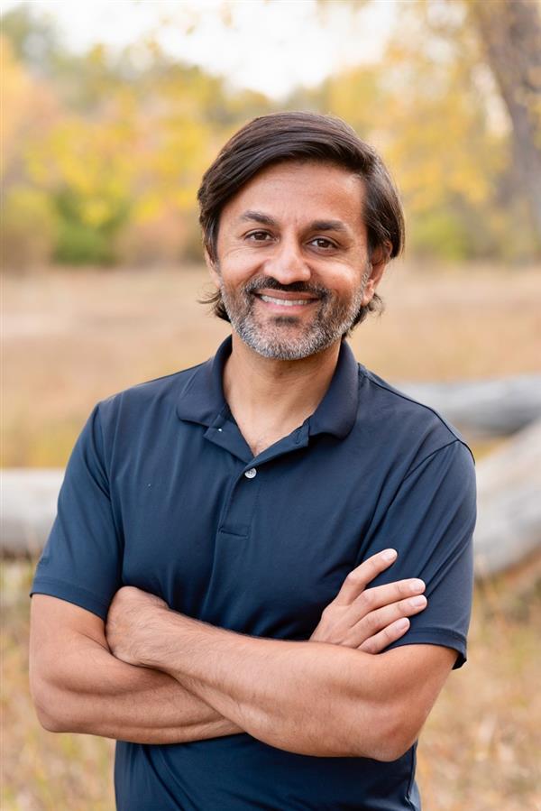 Man in blue polo shirt in anature setting