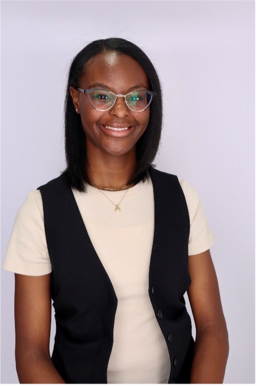 Young Black woman in white short with black vest