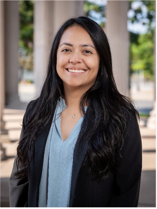 young latina woman in blue shirt and black blazer