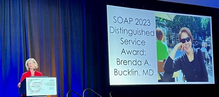 Joy Hawkins, MD presenting the 2023 SOAP Distinguished Service Award to Brenda Bucklin, MD