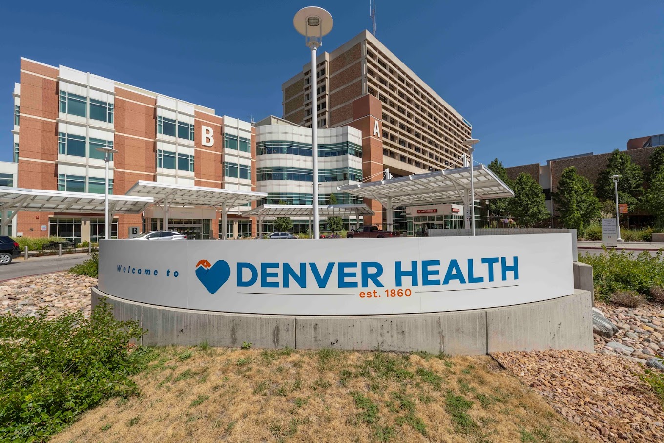 Exterior of Denver Health Medical center on a bright, sunny day