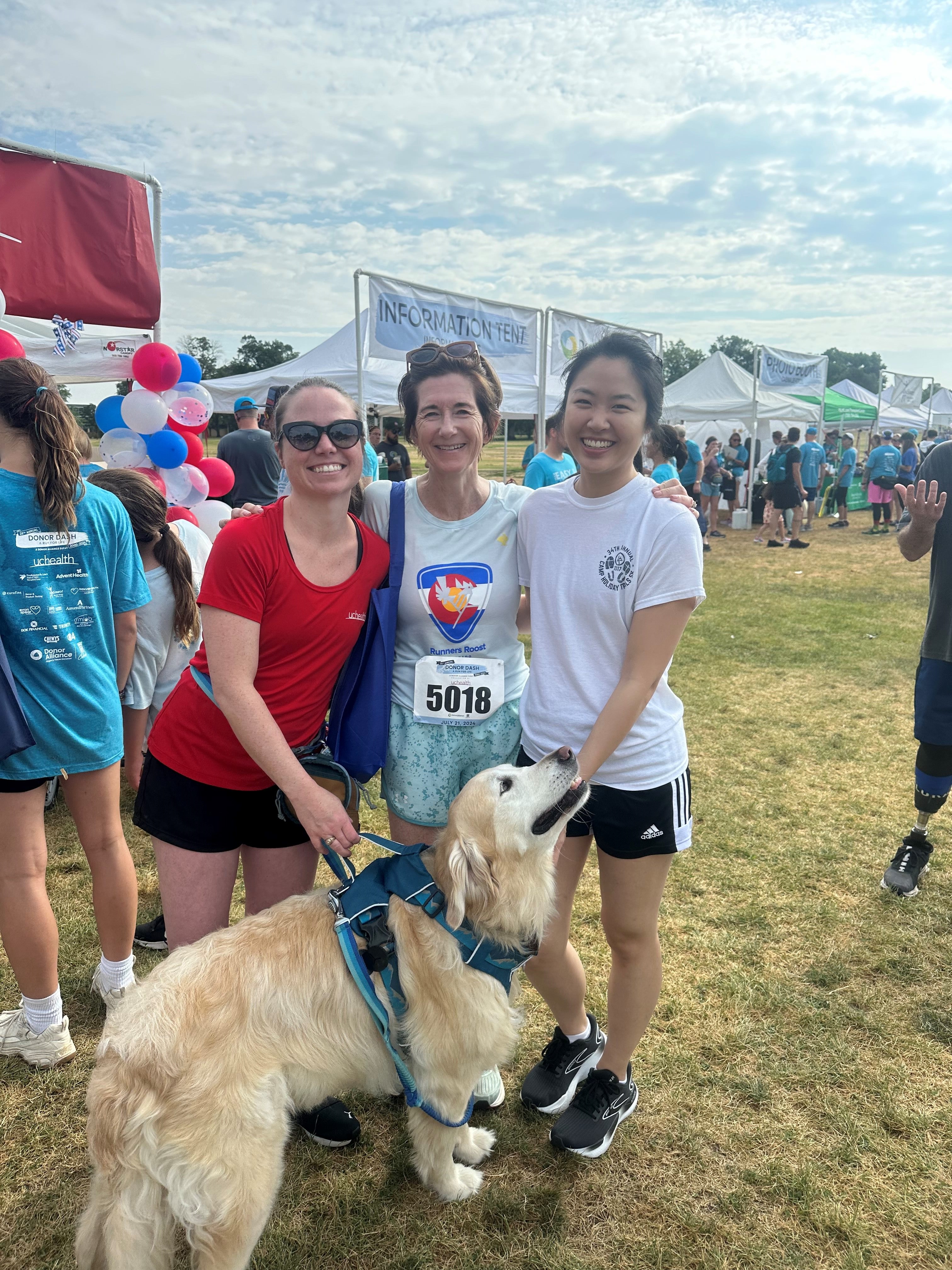 Dr Luu, Dr Zwald, Ali Walker and her dog standing and smiling after the 5k Donor Dash race