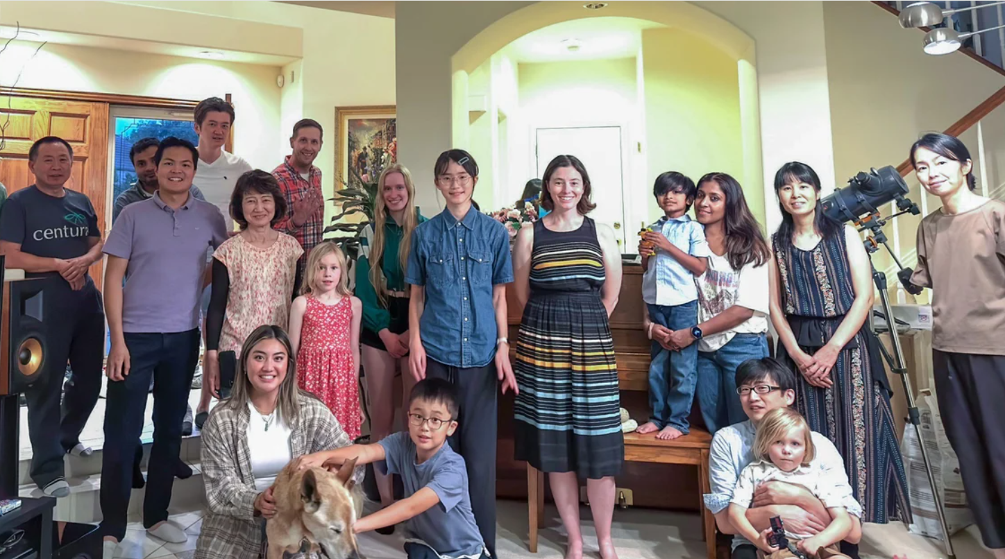 Mayumi Fujita, MD, PhD, at a summer lab party at her home in July 2023 with lab members and their families
