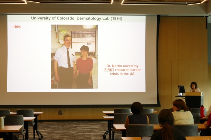 Mayumi Fujita's presentation slide with a picture of her and David Norris in 1994