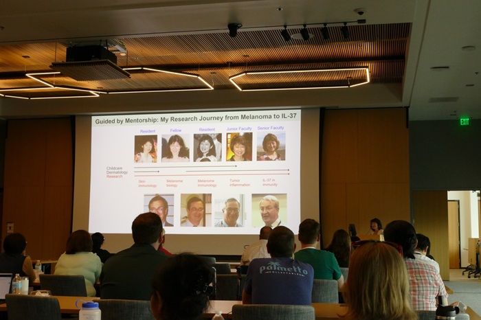 Mayumi Fujita's presentation slide showing her career and David Norris' careers as parallel timeline
