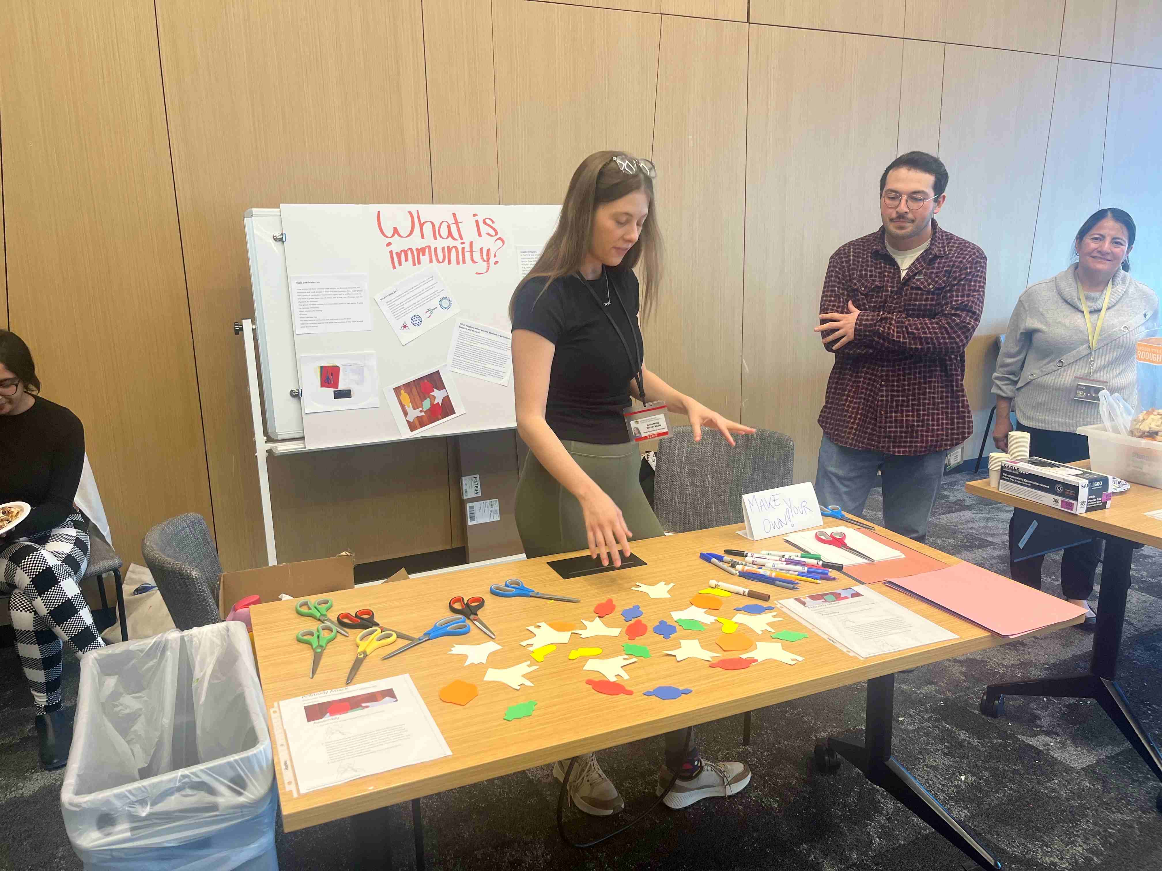 Photooftablewithyouthscienceactivitywithvolunteers