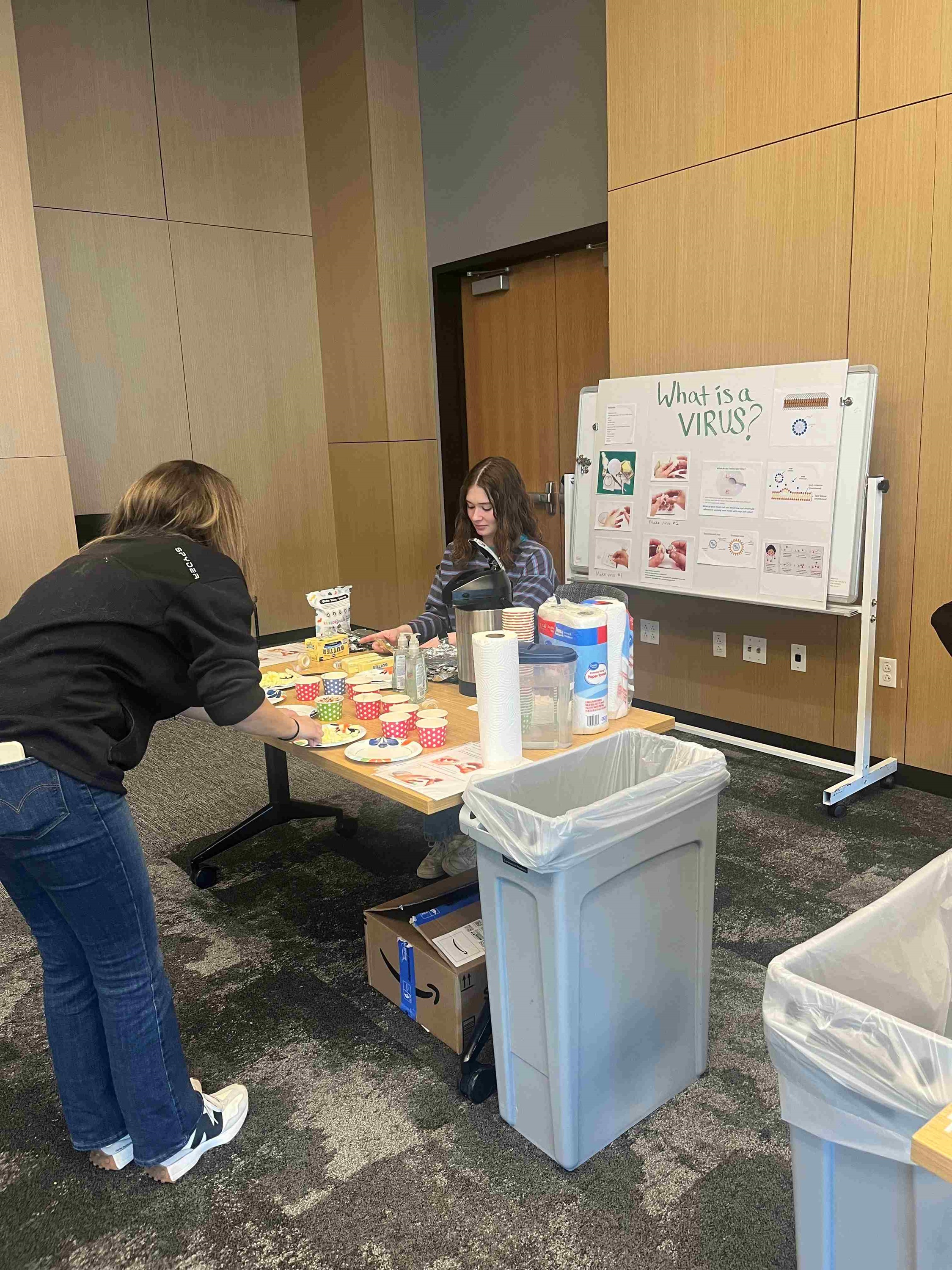 Photooftablewithyouthscienceactivitywithvolunteers