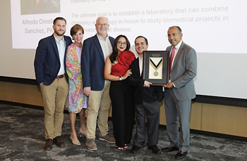scholars holding an award