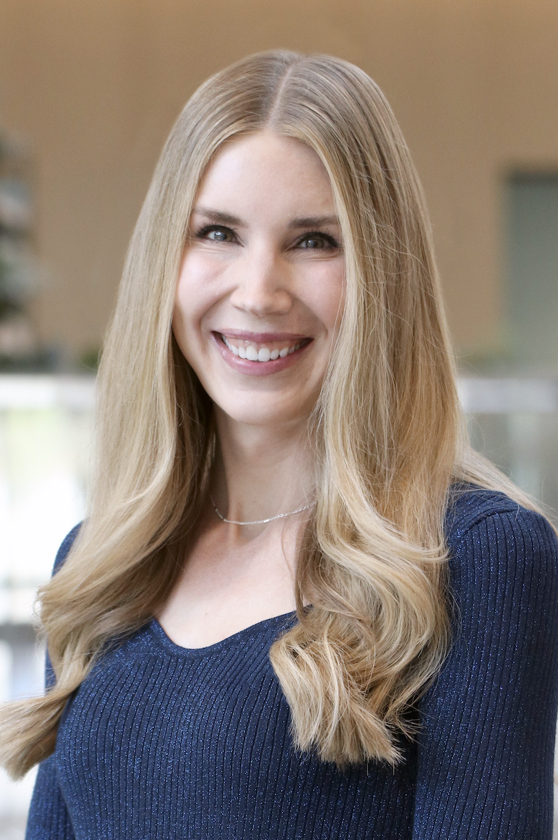 female smiling with blonde hair, headshot