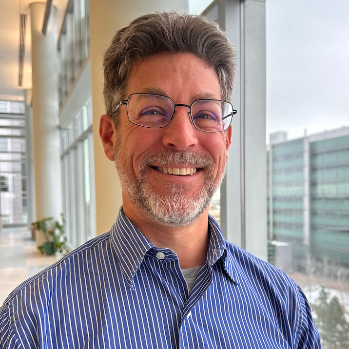 man smiling for a headshot