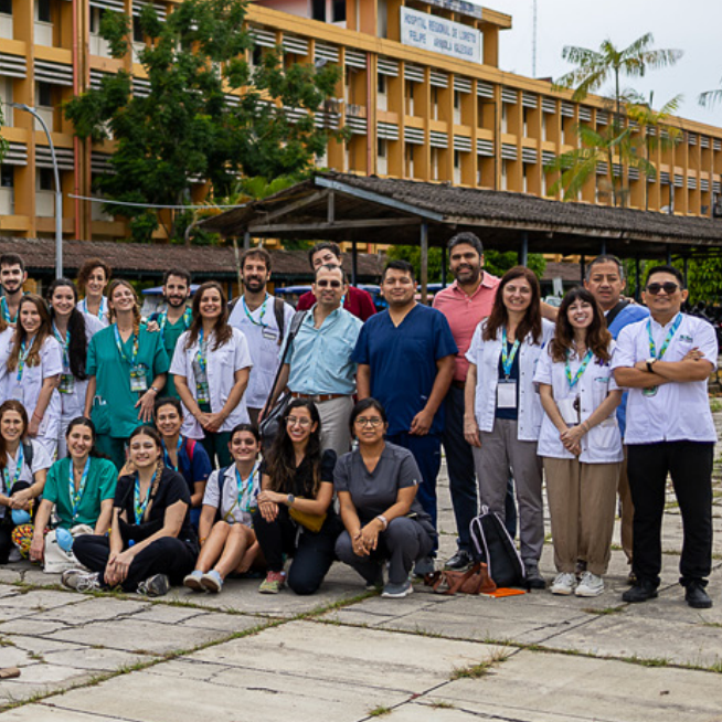 a group of people standing for a group photo