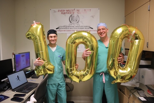 DrewKernMDandStevenOjemannMDholding100balloonsintheMRIsuiteatUCHealth