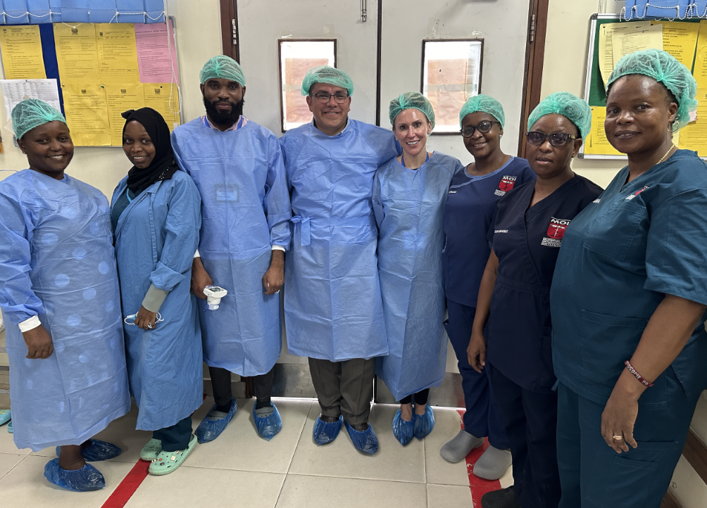 Dr. Cava and Maria Marsolek, PA-C with physicians and nurses outside the OR at MOI