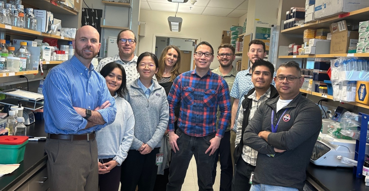 Dr. Todd Hankinson and Dr. Siddhartha Mitra with lab team