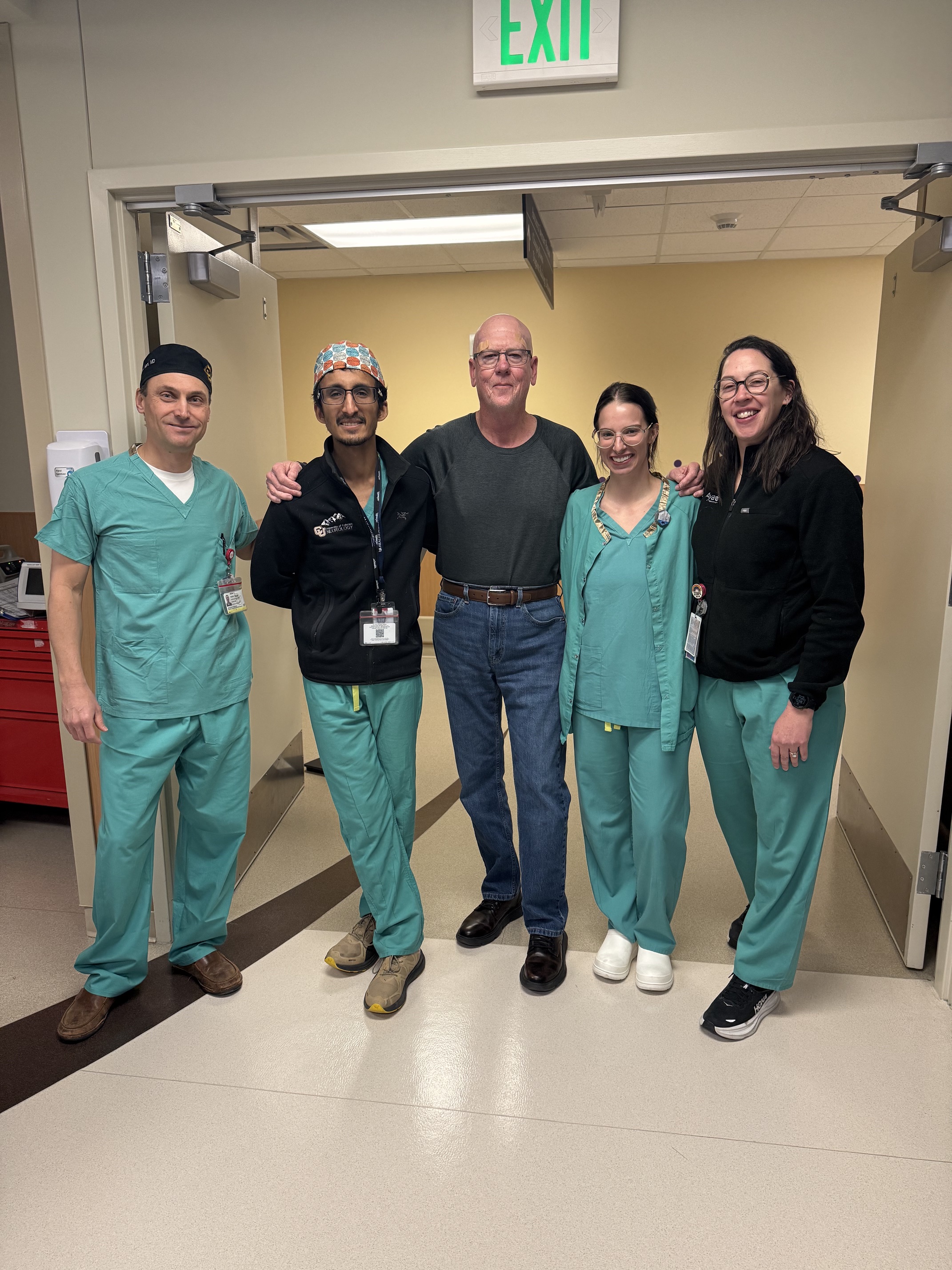 Stephen with his care team in the recovery area after his procedure.