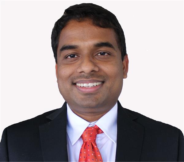 man smiling for a headshot